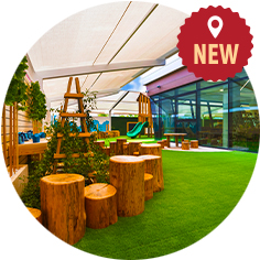 An outdoor area with a wooden table and chairs.